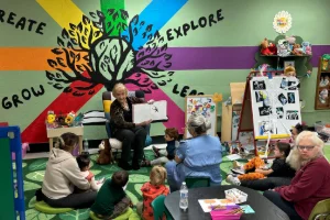 The Kids' Zone storytime reading with a large group